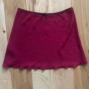 Brandy Melville skirt with black lace trim and bow detail